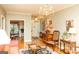 Spacious living room showcasing hardwood floors, an entry foyer, and dining area at 17 Hampton Way, Carrollton, GA 30116