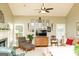 Inviting living room with fireplace, ceiling fan, and windows providing natural light at 17 Hampton Way, Carrollton, GA 30116