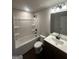 A full bathroom featuring modern fixtures, a shower-tub combo, and a vanity with a bright white countertop at 1151 Park Center Nw Cir, Austell, GA 30168