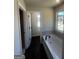 Bathroom with a tub and lots of natural light at 1151 Park Center Nw Cir, Austell, GA 30168