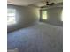 Spacious bedroom with carpet, a tray ceiling, and large windows offering natural light at 1151 Park Center Nw Cir, Austell, GA 30168