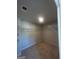 A well-lit walk in closet with carpeted floors and wire shelving offers practical storage solutions at 1151 Park Center Nw Cir, Austell, GA 30168