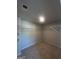A well-lit walk in closet with carpeted floors and wire shelving offers practical storage solutions at 1151 Park Center Nw Cir, Austell, GA 30168