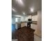 Open kitchen with stainless steel appliances, granite countertops and wooden floors at 1151 Park Center Nw Cir, Austell, GA 30168