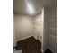 A practical laundry room is equipped with shelving, providing ample space for sorting and storing essentials at 1151 Park Center Nw Cir, Austell, GA 30168