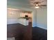 Open floor plan seamlessly connects the living area to the modern kitchen with white cabinets at 1151 Park Center Nw Cir, Austell, GA 30168