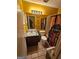 Cozy bathroom featuring tiled floors, a single sink vanity, and a shower with patterned curtain at 6296 Marbut Farms Trl, Lithonia, GA 30058