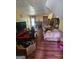 Cozy living room featuring a fireplace, and a bright, open floor plan at 6296 Marbut Farms Trl, Lithonia, GA 30058