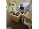 Inviting living room featuring sofas, and a bright, open floor plan at 6296 Marbut Farms Trl, Lithonia, GA 30058