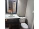 Bathroom features a new vanity, toilet and mirror at 3818 Mulkey Sw Cir, Marietta, GA 30008