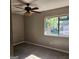 Bedroom with neutral walls, ceiling fan, window with tree view, carpeted flooring at 3818 Mulkey Sw Cir, Marietta, GA 30008