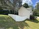 View of expansive, fenced backyard and side of home with traditional architectural details at 85 Creekside Trl, Covington, GA 30016