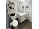 Cozy bathroom with decorative black-and-white shower curtain and a vanity at 85 Creekside Trl, Covington, GA 30016