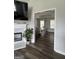 View of dining room through arched doorway, highlighting hardwood floors and natural light at 85 Creekside Trl, Covington, GA 30016