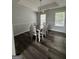 Bright dining area featuring a modern chandelier and abundant natural light at 85 Creekside Trl, Covington, GA 30016