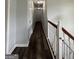 Hallway with freshly painted walls and stained hardwood flooring at 85 Creekside Trl, Covington, GA 30016
