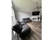 Inviting living room with modern furnishings, fireplace, and sleek ceiling fan at 85 Creekside Trl, Covington, GA 30016