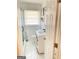 Stylish bathroom with a modern vanity, hexagon tile flooring, and glass enclosed shower at 3385 M L King Jr Sw Dr, Atlanta, GA 30331