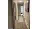 Well-lit hallway with wood floors and a patterned rug leading to the rooms, creating a bright and inviting space at 3385 M L King Jr Sw Dr, Atlanta, GA 30331