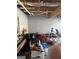 Unfinished basement with exposed ceiling and a piano to the side at 213 Bonnie Sue Dr, Villa Rica, GA 30180