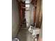 Unfinished basement area with exposed framing, a toilet, and other plumbing fixtures at 213 Bonnie Sue Dr, Villa Rica, GA 30180