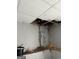 Damaged drop ceiling with exposed pipes and signs of water damage at 213 Bonnie Sue Dr, Villa Rica, GA 30180