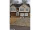 Charming split-level home with a two-car garage, brick accents, and welcoming front entrance at 213 Bonnie Sue Dr, Villa Rica, GA 30180
