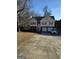 Inviting split-level home with two-car garage, brick accents, and driveway parking at 213 Bonnie Sue Dr, Villa Rica, GA 30180