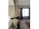Bright living room with large window featuring neutral drapes and a colorful area rug at 213 Bonnie Sue Dr, Villa Rica, GA 30180