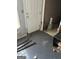 Mud room featuring a white entry door and gray painted walls in need of repair at 213 Bonnie Sue Dr, Villa Rica, GA 30180