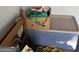 Interior angle of a small storage space, filled with a variety of items including boxes and bins at 213 Bonnie Sue Dr, Villa Rica, GA 30180