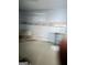 Incomplete, blurry image of an unfinished space with exposed walls and floors, possibly under renovation at 213 Bonnie Sue Dr, Villa Rica, GA 30180