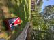 This backyard showcases a verdant lawn, privacy fence, and retaining wall at 4080 Longford Ne Dr, Marietta, GA 30066