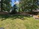 Lovely backyard with lawn, stone retaining wall and privacy fence at 4080 Longford Ne Dr, Marietta, GA 30066