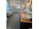 Elegant bathroom featuring a clawfoot tub, walk-in glass shower, and mosaic tile flooring at 4080 Longford Ne Dr, Marietta, GA 30066
