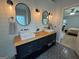 Modern bathroom with dual sinks, wood counters, mosaic tile and natural lighting at 4080 Longford Ne Dr, Marietta, GA 30066