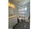 Updated bathroom featuring modern vanity, hexagon floor tiles, and subway tile shower at 4080 Longford Ne Dr, Marietta, GA 30066