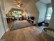 Spacious bonus room with vaulted ceiling, skylight, ceiling fan, hardwood floors, and lots of natural light at 4080 Longford Ne Dr, Marietta, GA 30066