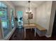 Charming dining area with bench seating, lots of natural light, and wood-look floors at 4080 Longford Ne Dr, Marietta, GA 30066