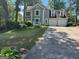 Charming two-story home featuring a spacious two-car garage, and lovely front yard at 4080 Longford Ne Dr, Marietta, GA 30066