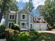 Charming two-story home featuring a spacious two-car garage, front porch, and landscaped front yard at 4080 Longford Ne Dr, Marietta, GA 30066