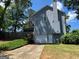 Side view of the charming home with a one-car garage and spacious lawn at 4080 Longford Ne Dr, Marietta, GA 30066