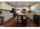 Spacious kitchen featuring dark hardwood floors and a wooden butcher block island at 4080 Longford Ne Dr, Marietta, GA 30066