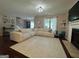 Cozy living room featuring a fireplace, hardwood floors, and neutral wall paint at 4080 Longford Ne Dr, Marietta, GA 30066