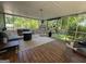 Relaxing screened-in porch with outdoor furniture and views of the landscaped yard at 4080 Longford Ne Dr, Marietta, GA 30066