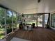 Screened porch featuring a wooden floor and offering a tranquil outdoor space at 4080 Longford Ne Dr, Marietta, GA 30066