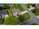 Breathtaking aerial view of the brick home showcasing the manicured lawn at 1120 Twin Bridge Ln, Peachtree City, GA 30269