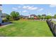 Large grassy backyard featuring a nice lawn, patio, and perimeter fence at 1120 Twin Bridge Ln, Peachtree City, GA 30269
