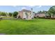 Spacious backyard features a large lawn, stone patio and mature trees at 1120 Twin Bridge Ln, Peachtree City, GA 30269
