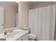Bathroom featuring a white sink, toilet, and shower with pink walls at 1120 Twin Bridge Ln, Peachtree City, GA 30269